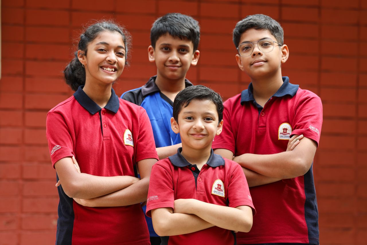 A group of confident school students in uniform