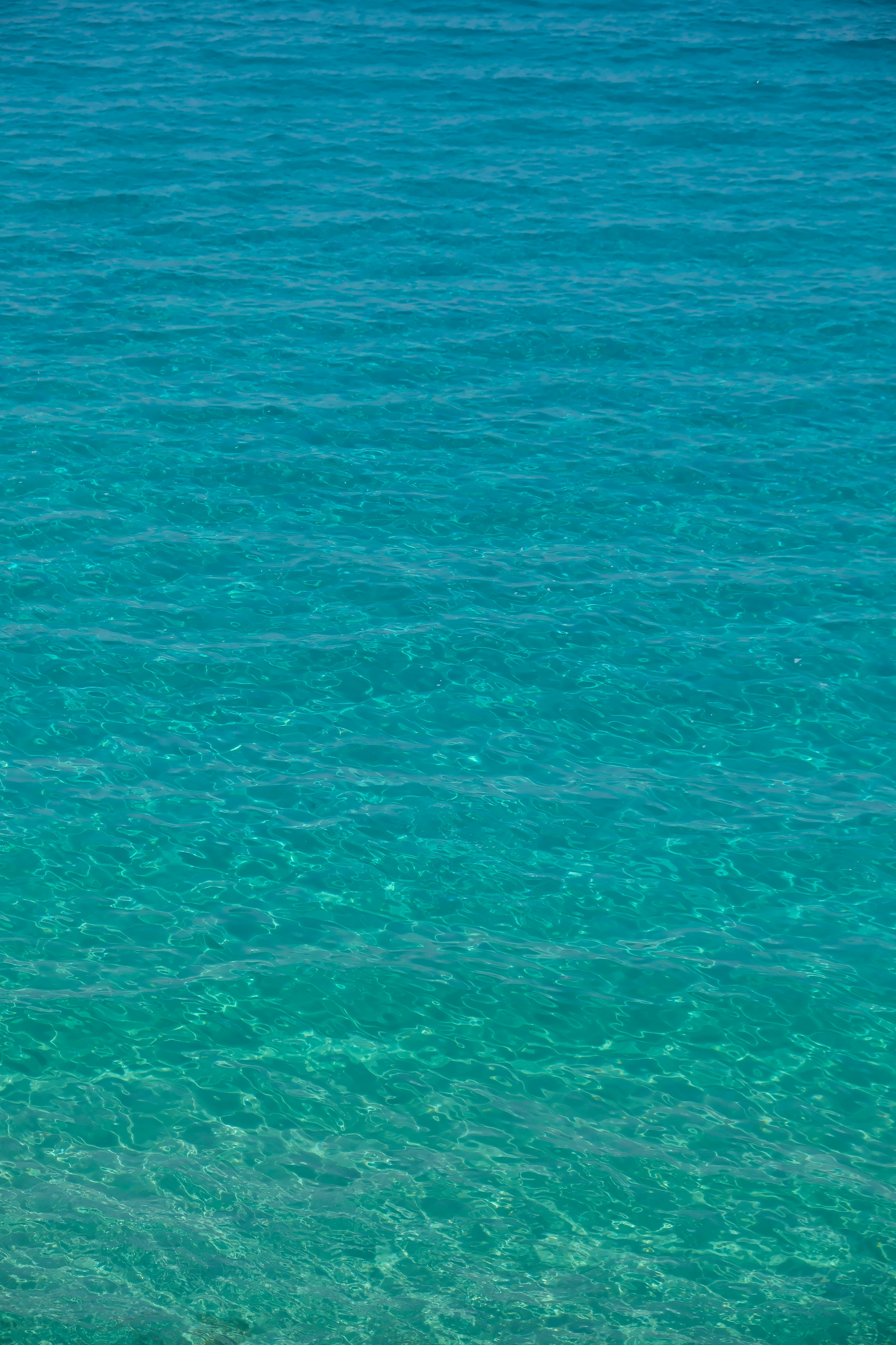 Crystal clear turquoise waters of the Aegean Sea in Aydın, Türkiye, showcasing natural serenity.