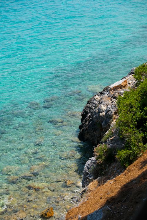 Free Explore the vibrant coastline of Aydın, Türkiye, showcasing clear azure waters and rocky shores. Stock Photo