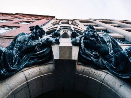 Free Captured in Hamburg, this photo showcases ornate architectural sculptures on a historic building facade. Stock Photo