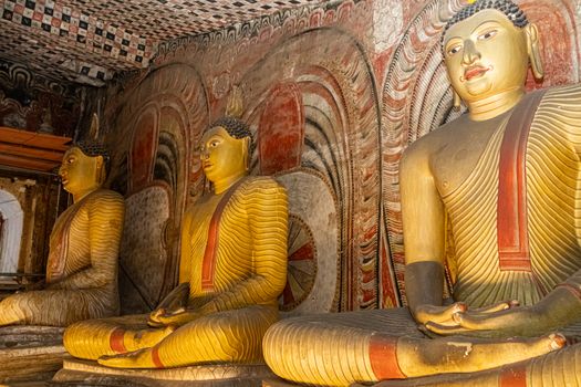 A captivating view of the intricately carved Buddha statues inside the historic Dambulla Cave Temple in Sri Lanka.
