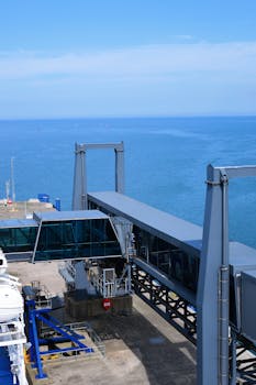 A view of the Cairnryan ferry terminal with the sea and blue sky in Scotland.