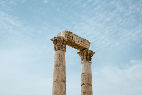 Free Stunning view of ancient Roman columns at the Temple of Hercules in Amman under a bright blue sky. Stock Photo
