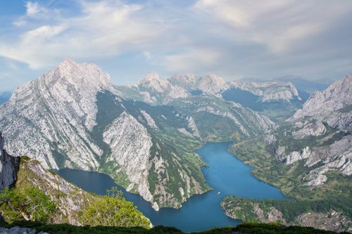 Free A stunning view of mountains and a river in Riaño, Spain, showcasing natural beauty. Stock Photo