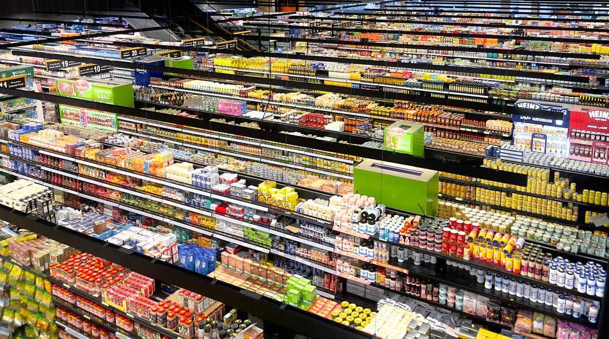 Aerial view of a retail store aisle filled with products, representing the membership retail industry
