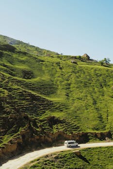 A tranquil drive through the lush green hills of Dagestan, Russia, showcasing natural beauty and serene landscapes.