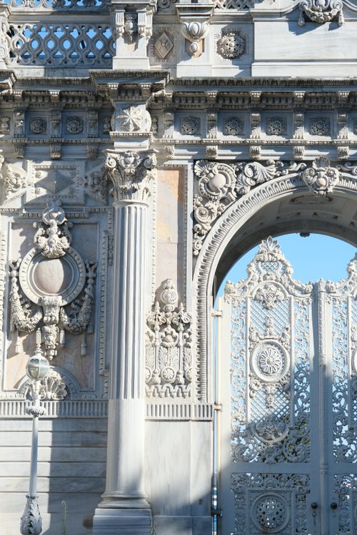 Free Close-up of an ornate marble gate showcasing intricate architecture under blue sky. Stock Photo