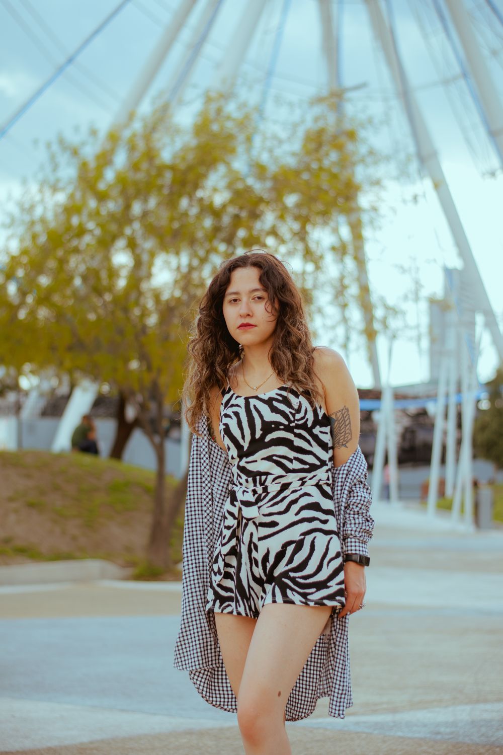 Stylish Young Woman in Urban Park Setting · Free Stock Photo