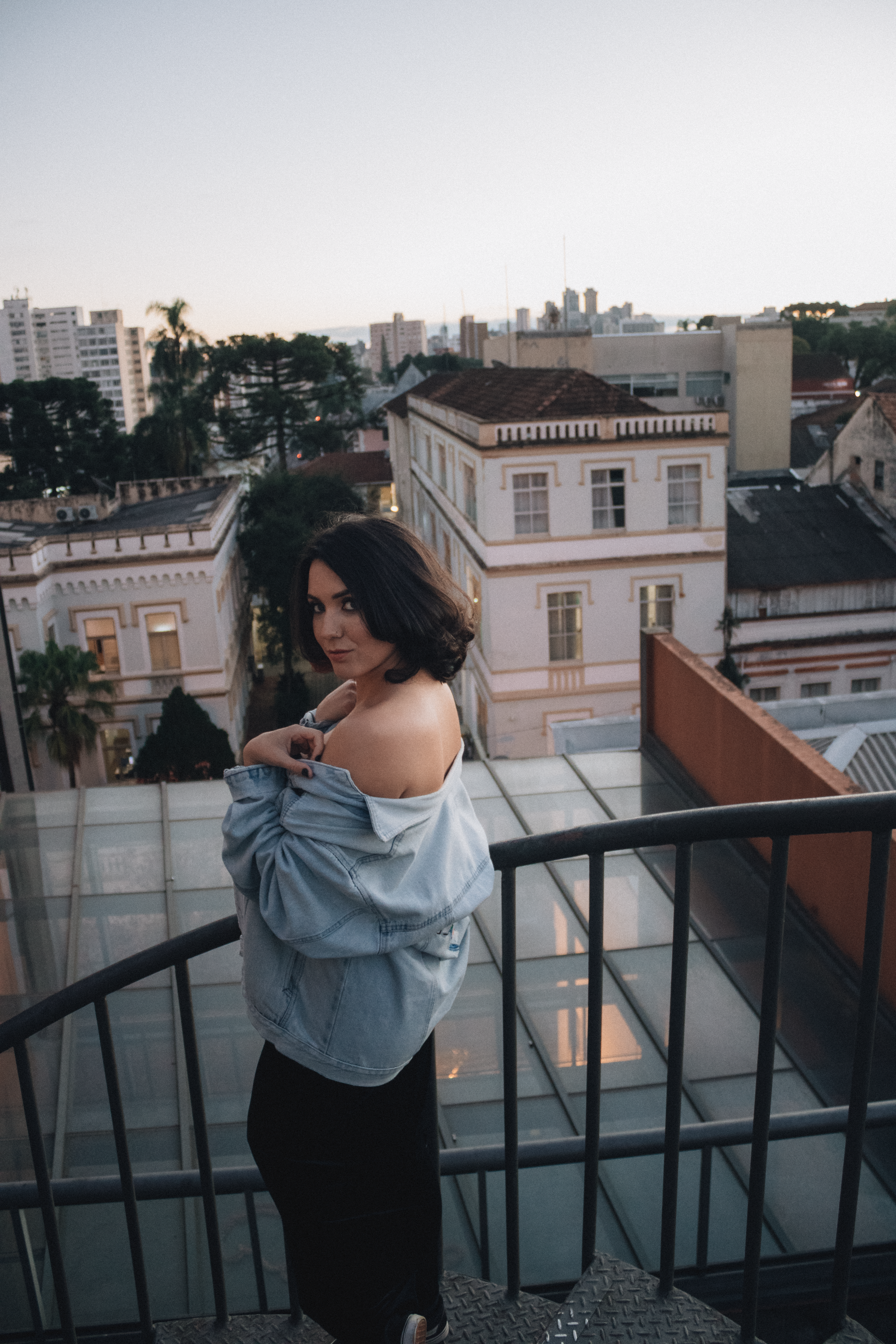 Urban rooftop portrait of a young woman · Free Stock Photo