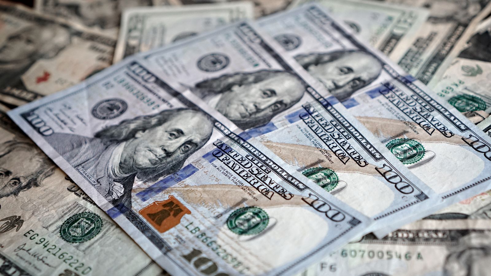 Close-up of various US dollar bills highlighting finance and economy.
