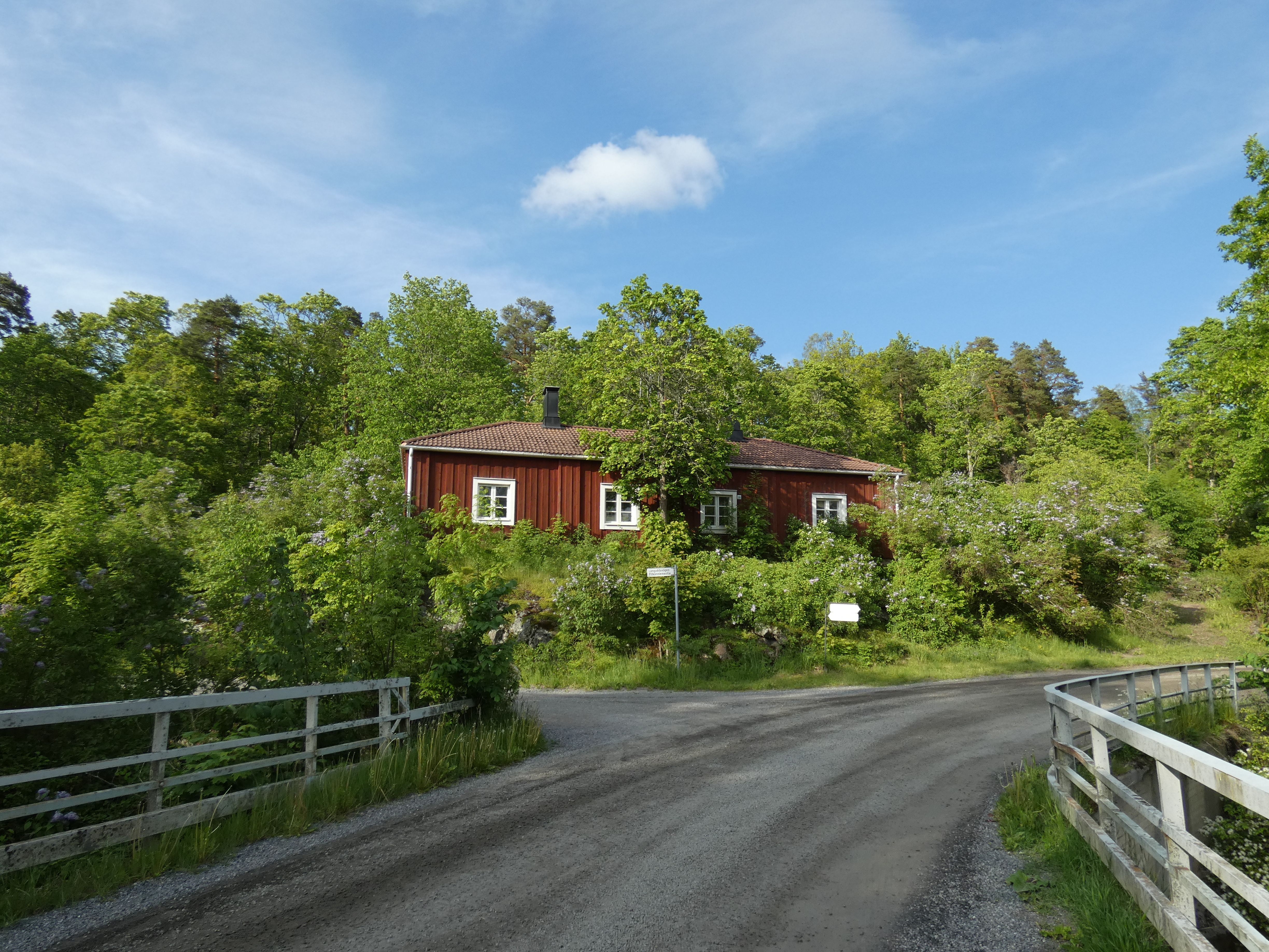 Charming Red Cottage in Lush Green Landscape