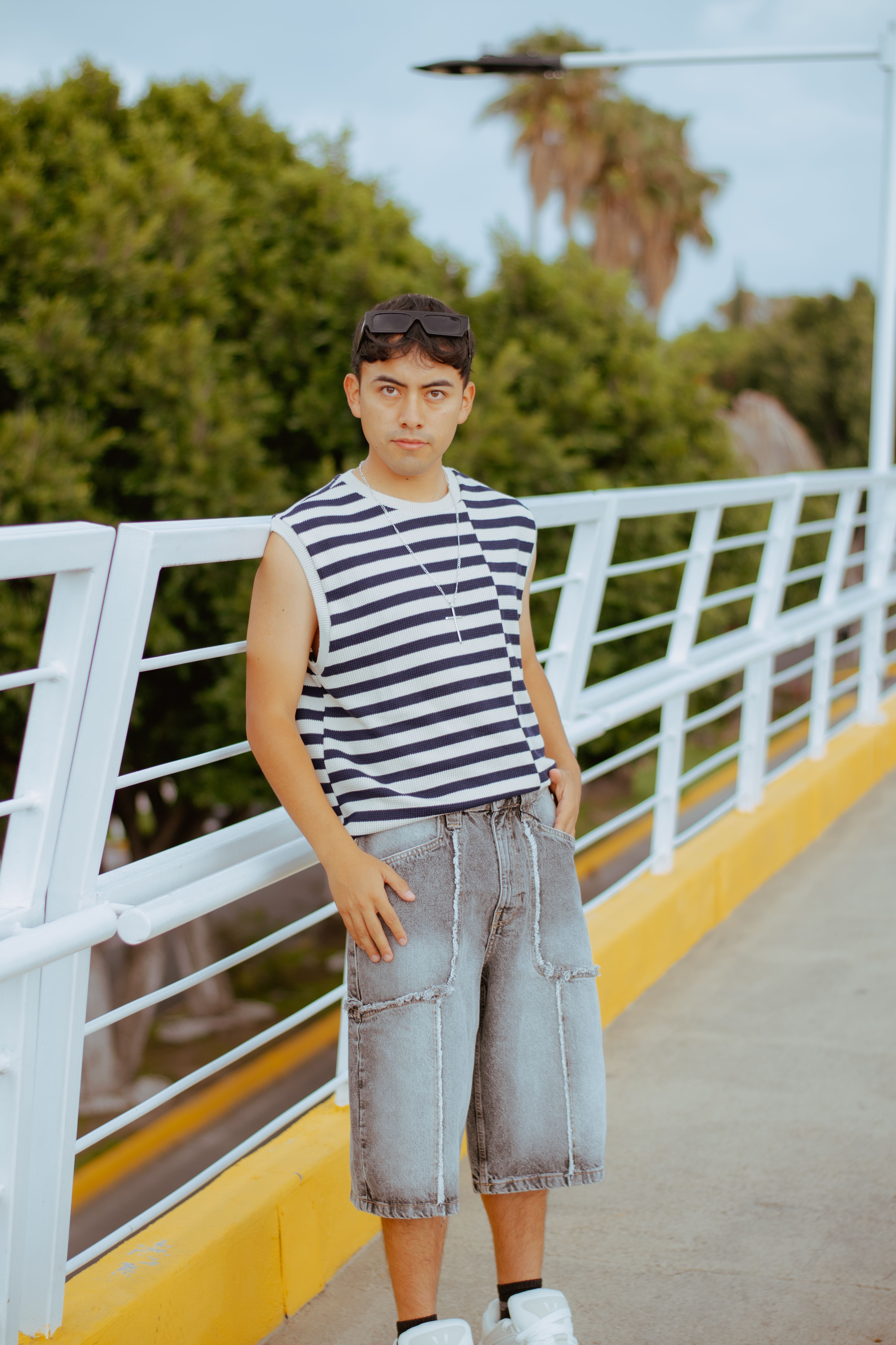 Young Man Posing on Urban Bridge Outdoors · Free Stock Photo