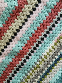 A vibrant crochet pattern showcasing colorful yarn textures and intricate designs.