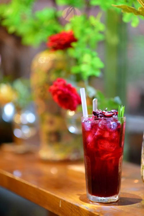 Free Chilled hibiscus tea with ice in a glass on a warm summer day, perfect for refreshment. Stock Photo