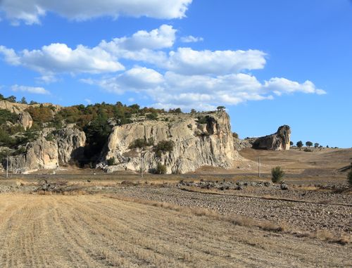 Free Stunning view of rocky cliffs and a blue sky with clouds, capturing natural beauty in a rural landscape. Stock Photo