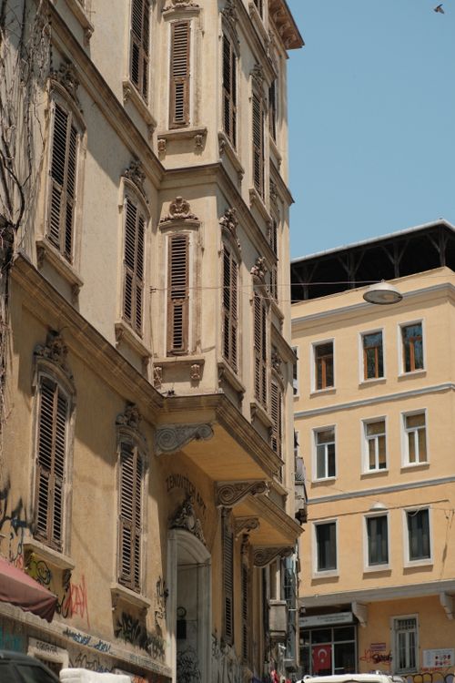 Free Charming historic buildings with classic shutters under a clear blue sky. Stock Photo