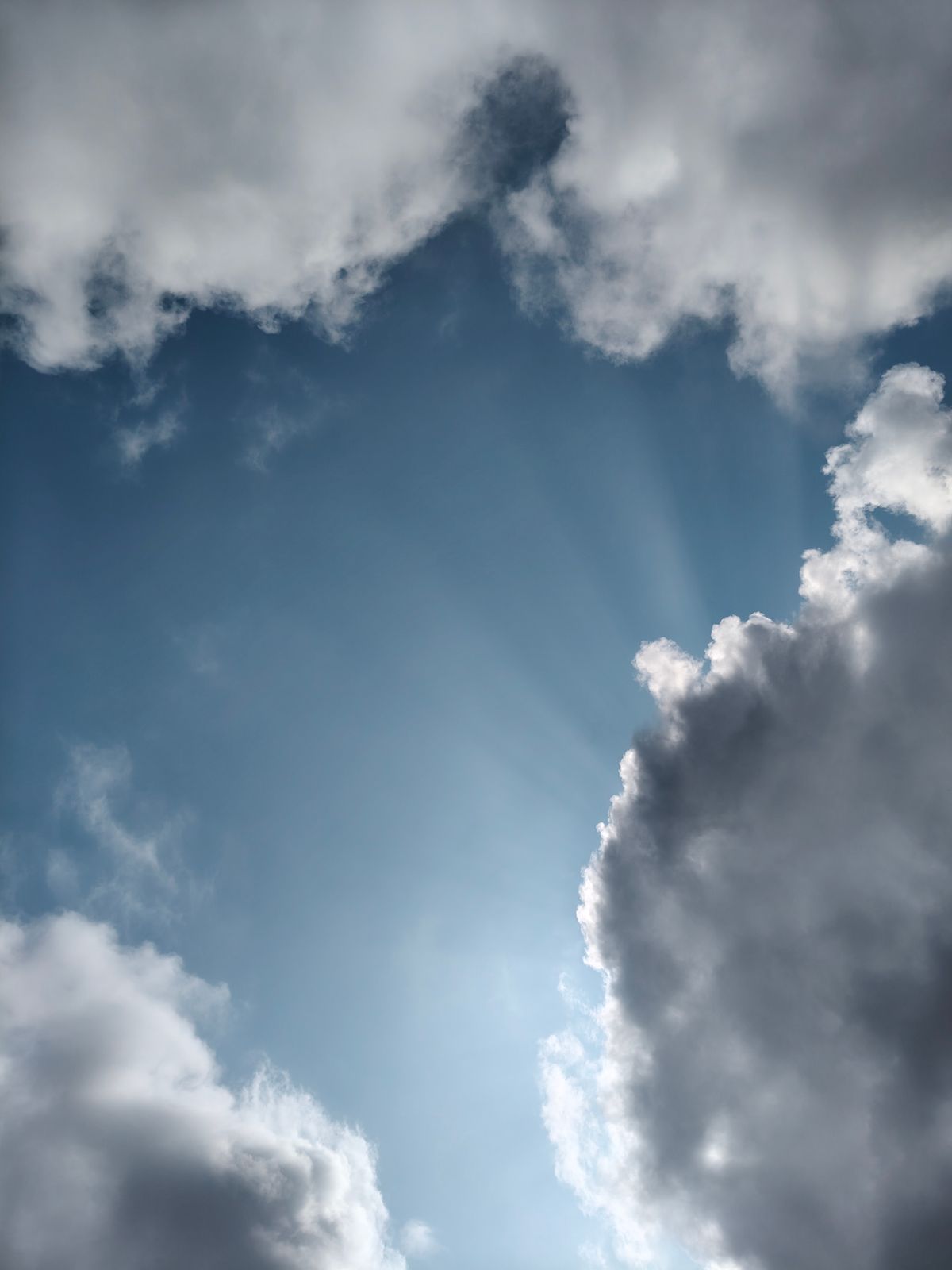 Dramatic Sun Rays Breaking Through Storm Clouds · Free Stock Photo
