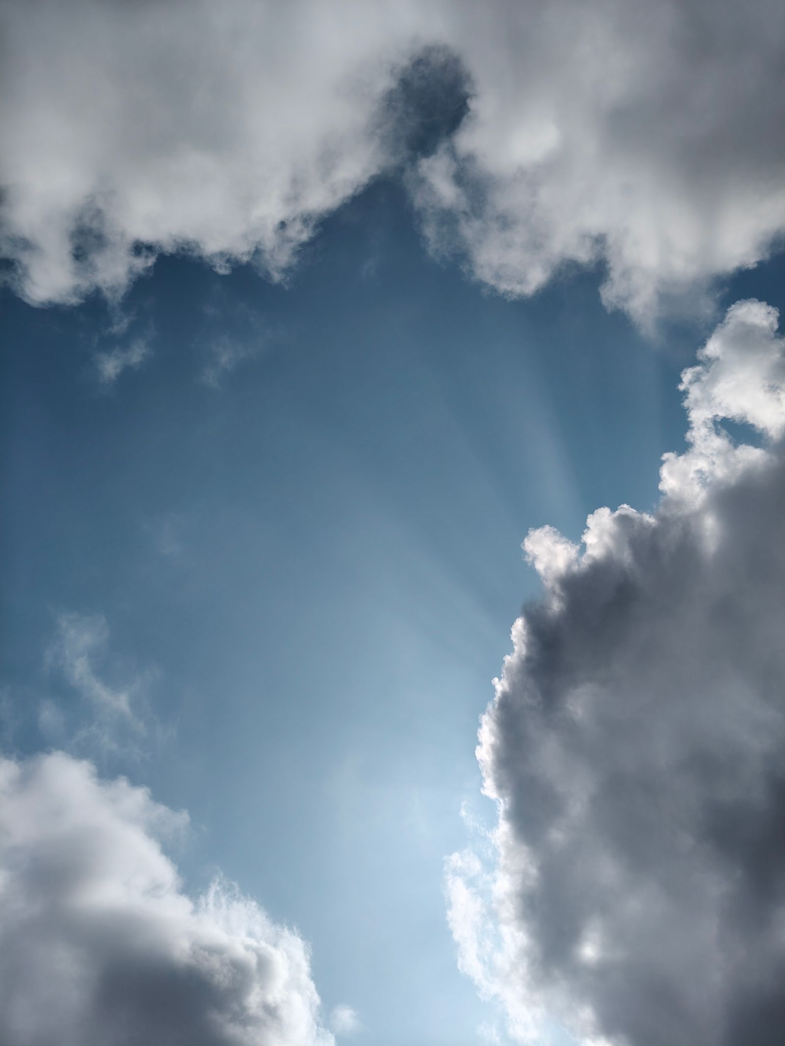 Dramatic Sun Rays Breaking Through Storm Clouds · Free Stock Photo