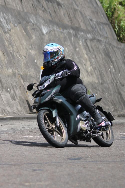 Free Motorcyclist taking a sharp turn on a sportbike in the city. Stock Photo