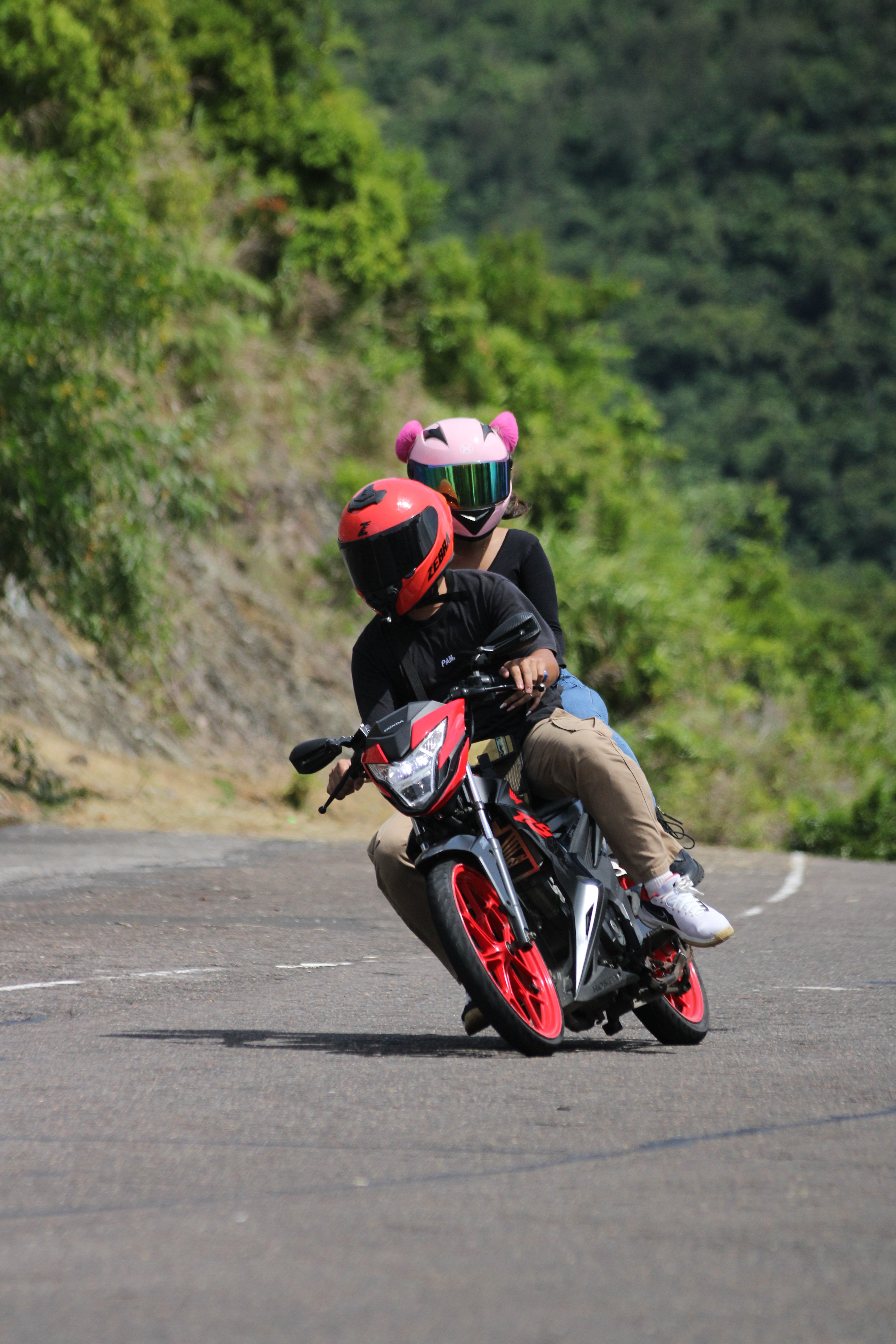 Couple Riding Motorcycle on Mountain Road · Free Stock Photo