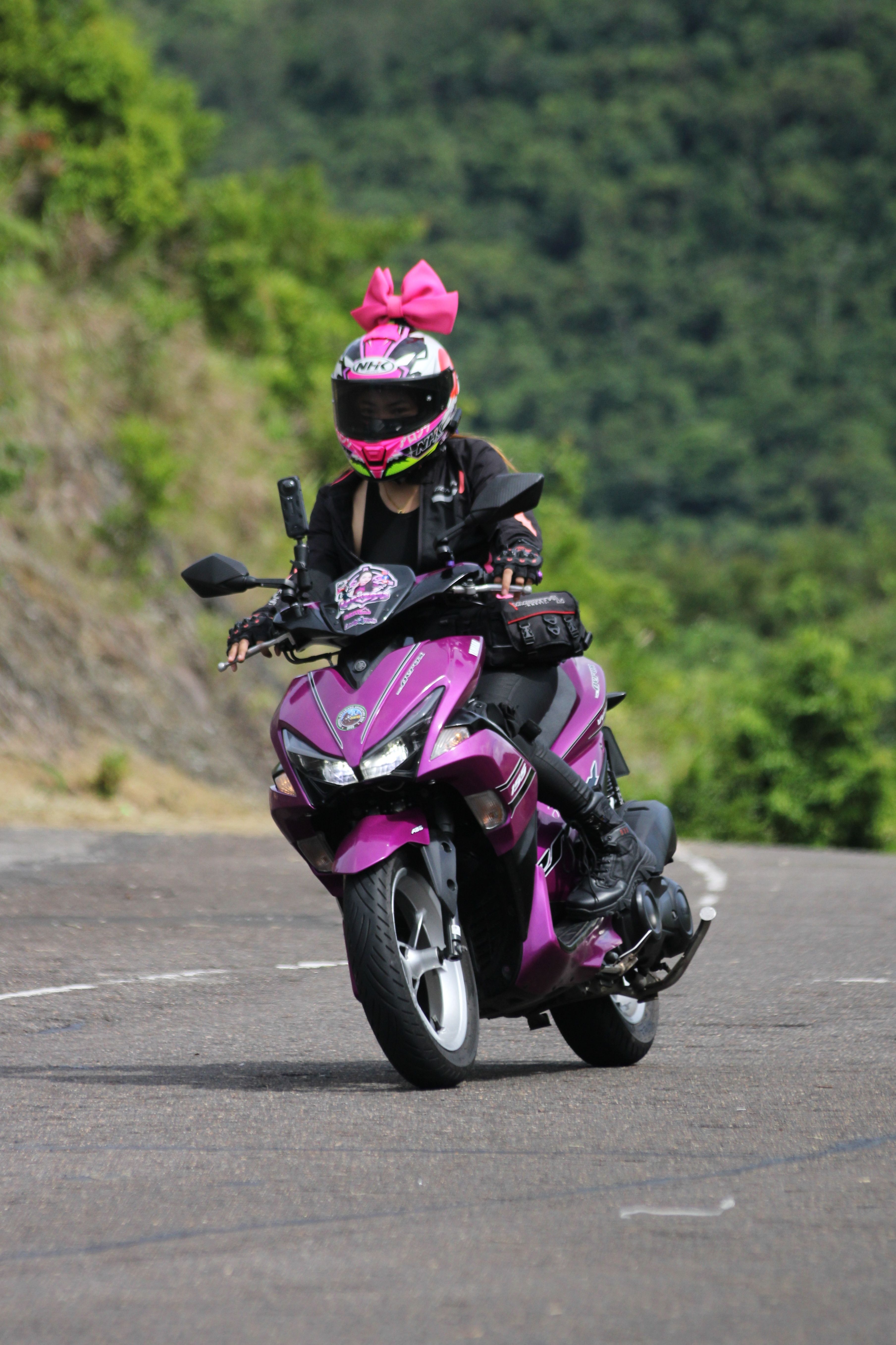 Woman Riding a Pink Motorcycle on Sunny Day · Free Stock Photo