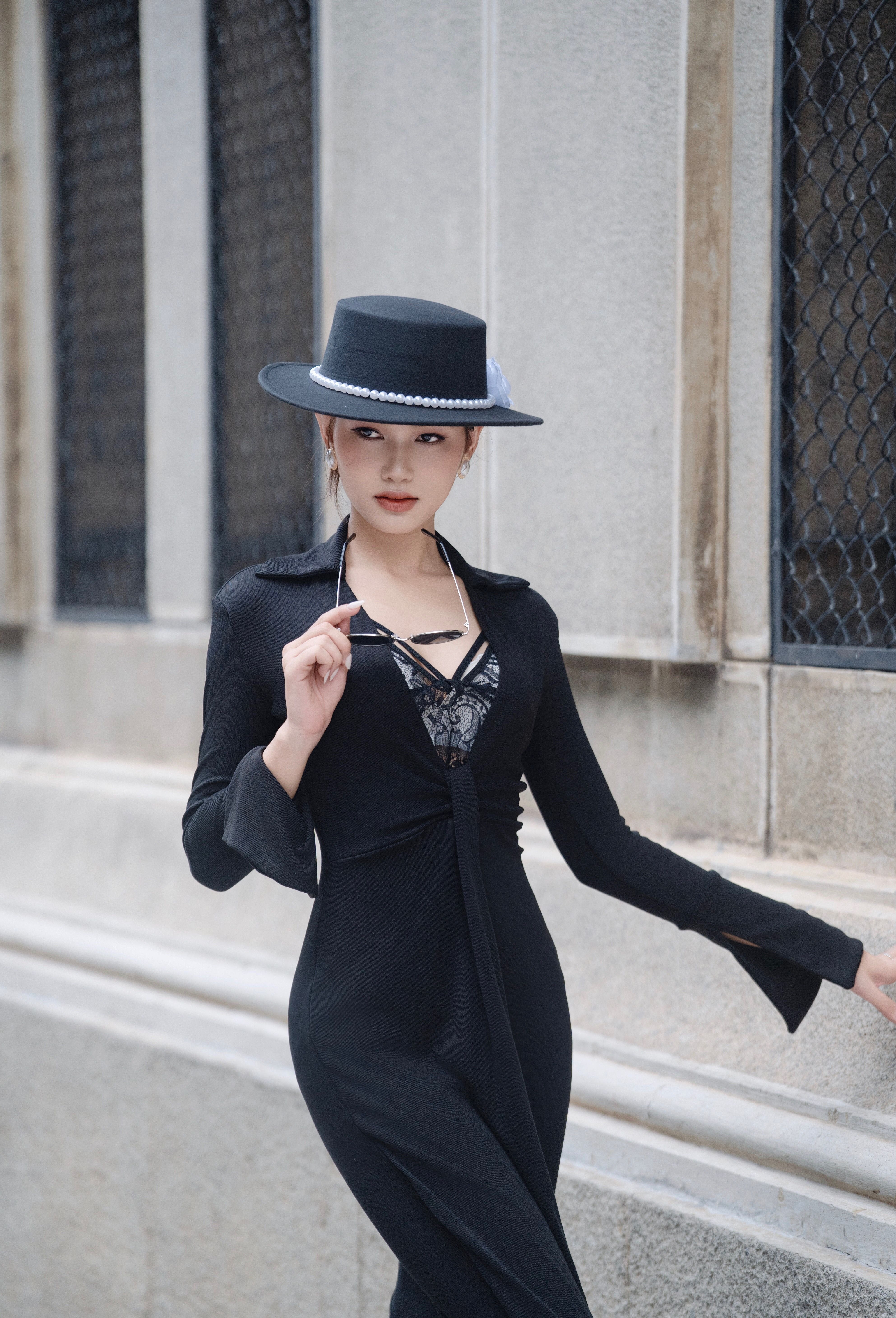 Stylish Woman in Black Dress and Hat Outdoors  Free Stock Photo