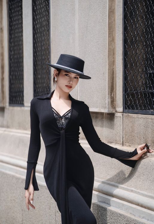 Woman in all black monochrome evening outfit