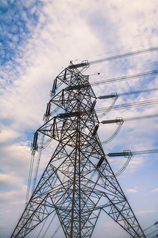 High Voltage Transmission Tower Under Blue Sky · Free Stock Photo