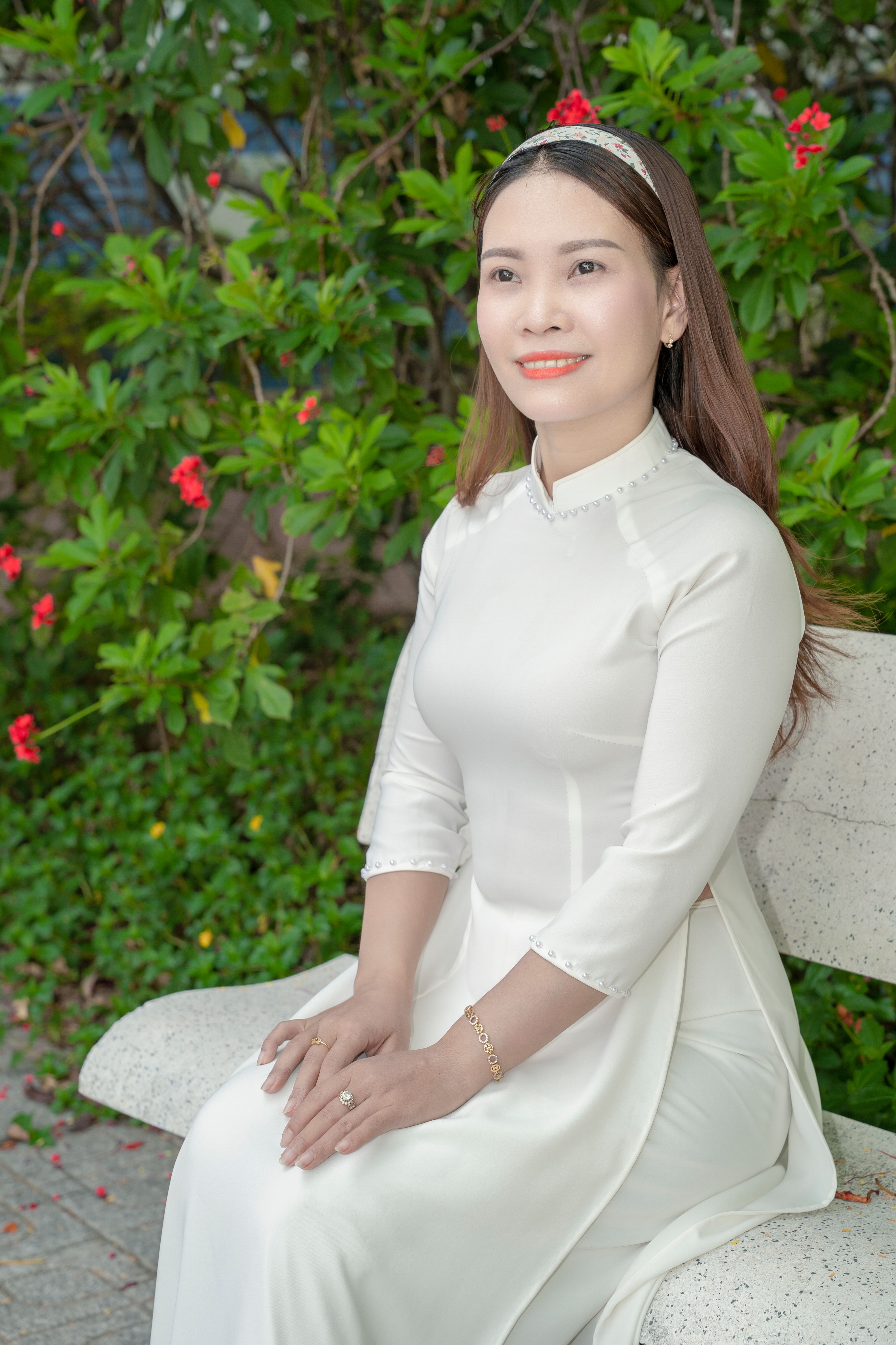 Woman in White Traditional Dress Sitting on Bench · Free Stock Photo