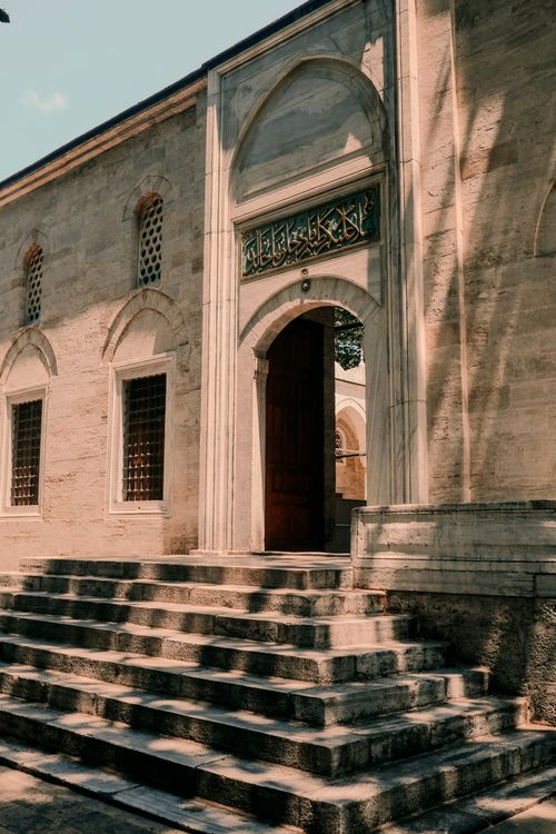 Free A beautiful view of Valide-I Cedid Cami in Istanbul showcasing its historic architecture and stone steps. Stock Photo