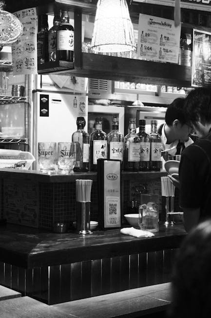 Behind the Counter at a Japanese Father & Daughter Izakaya Restaurant Behind the Counter at a Japanese Father & Daughter Izakaya Restaurant