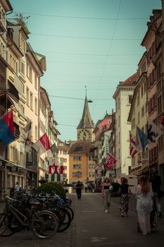 Discover the vibrant street life and historic buildings in central Zurich, Switzerland.