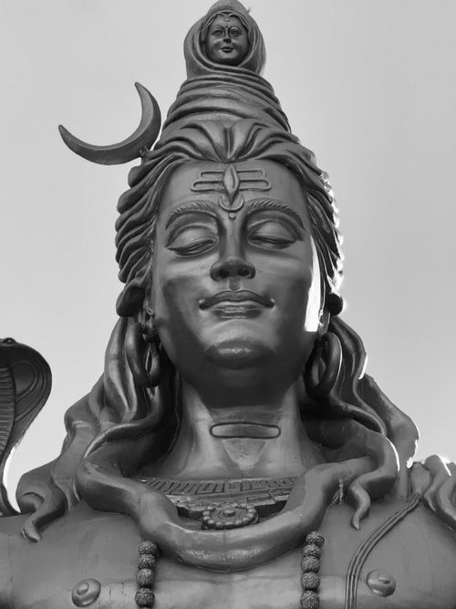 Free Close-up of a peaceful Shiva statue in monochrome, highlighting intricate details. Stock Photo