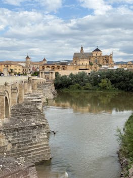 Scenic view of the Roman Bridge and the Mosque-Cathedral of Córdoba in Spain.