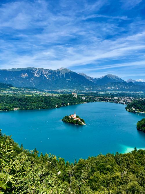 Free Stunning aerial view of Lake Bled, Slovenia with island church and surrounding mountains. Stock Photo