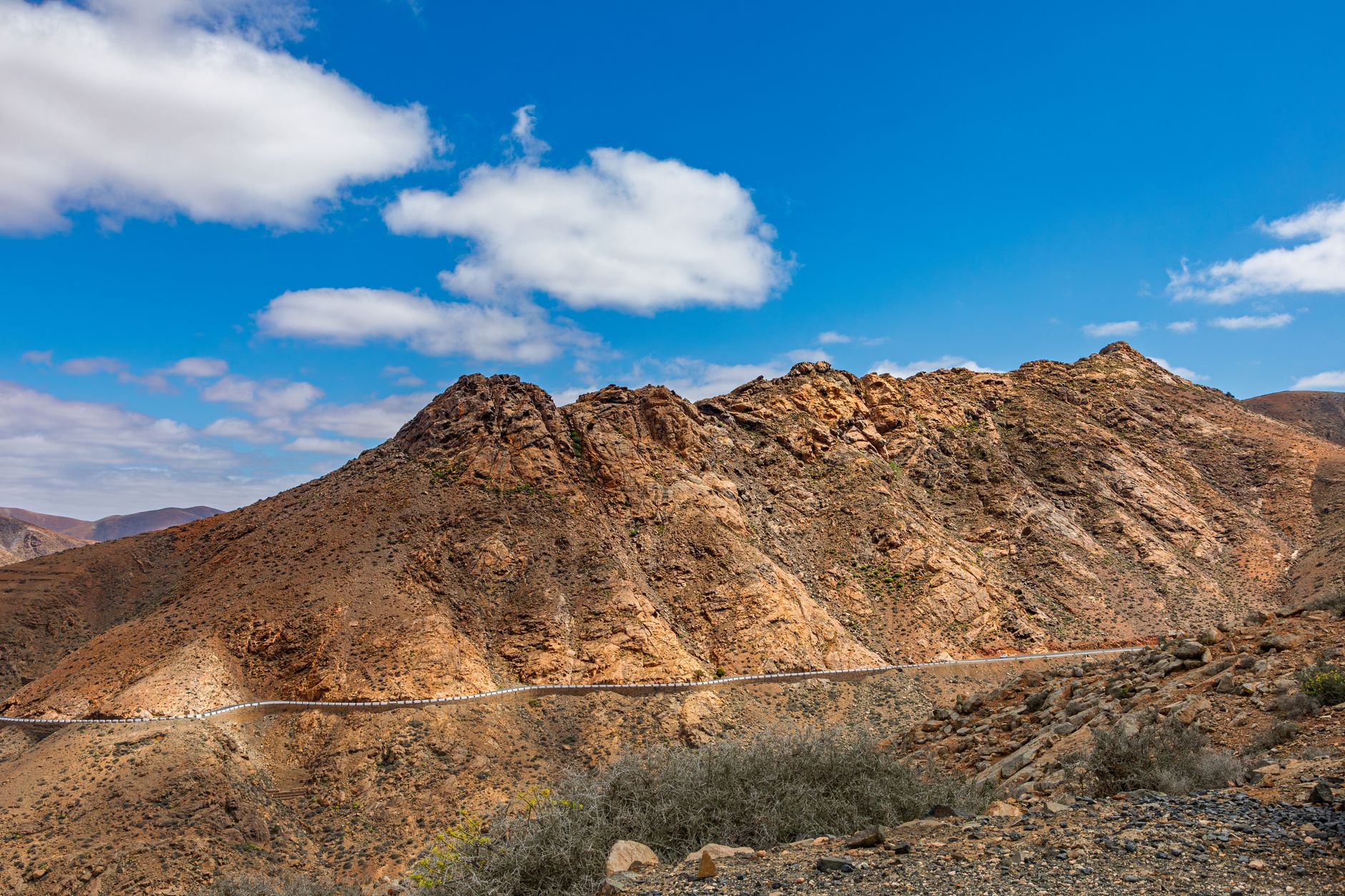 Stunning rocky mountain landscape under a bright blue sky in the Canary Islands.