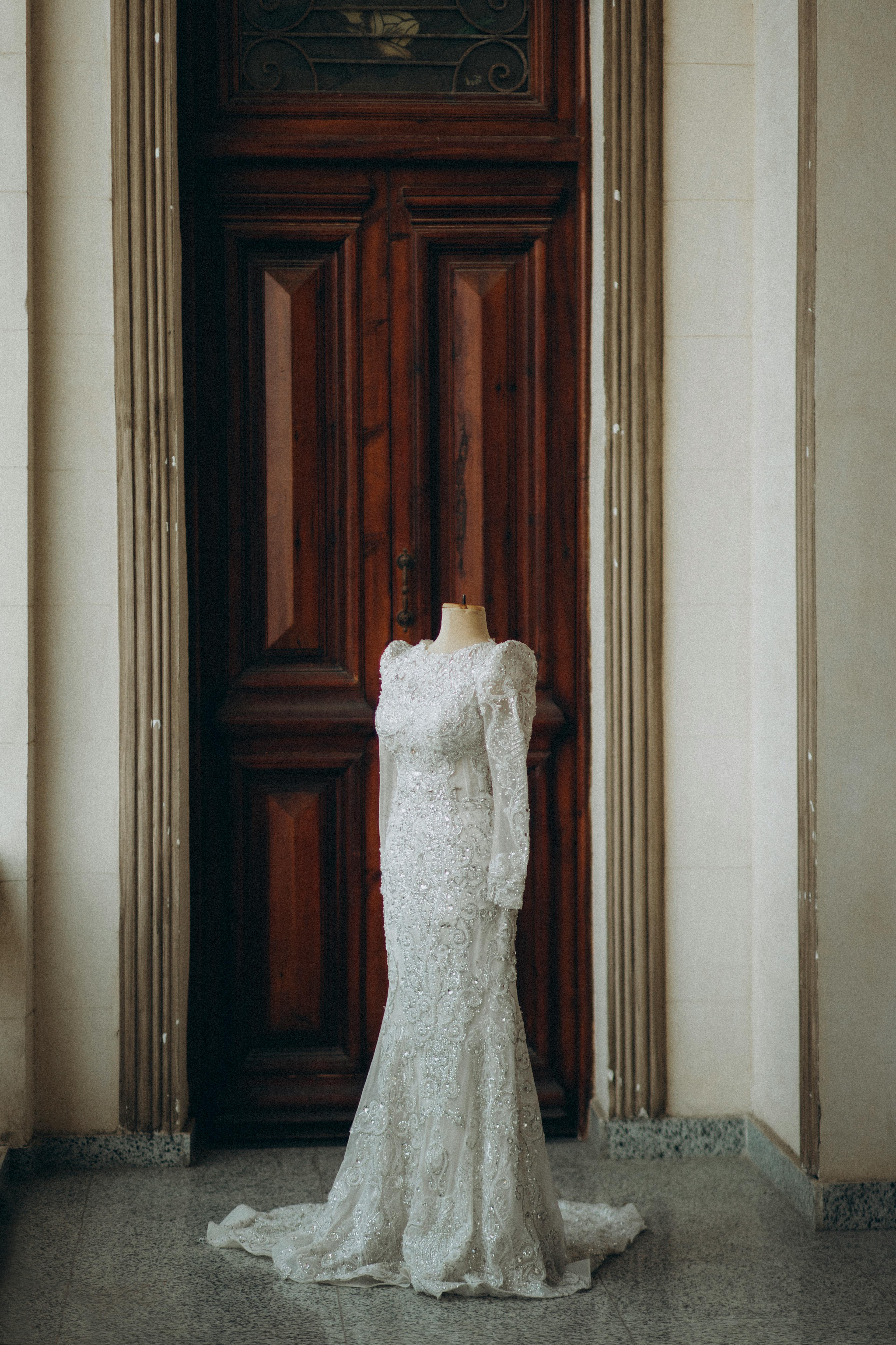 A stunning white wedding dress displayed in an elegant setting in Egypt.
