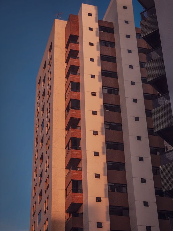 Modern High-Rise Building at Sunset · Free Stock Photo