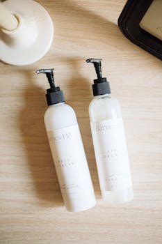 Flatlay of Barnes Hill artisan skincare bottles on a natural wood surface.