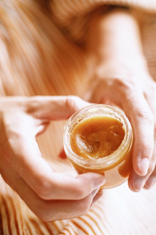 Free Close-up of hands holding a jar of natural skincare product, highlighting its texture. Stock Photo