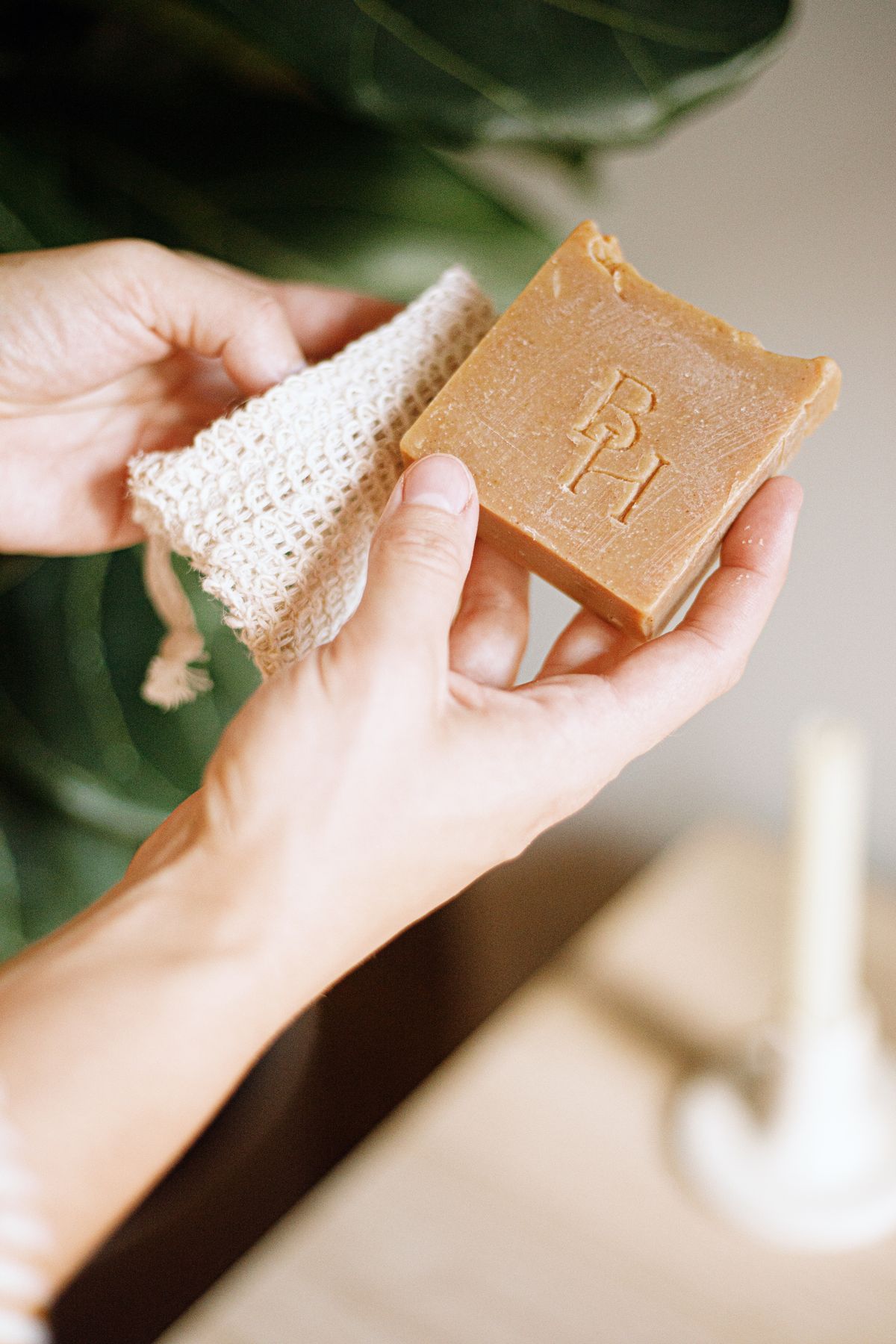 Natural handmade soap held in two hands