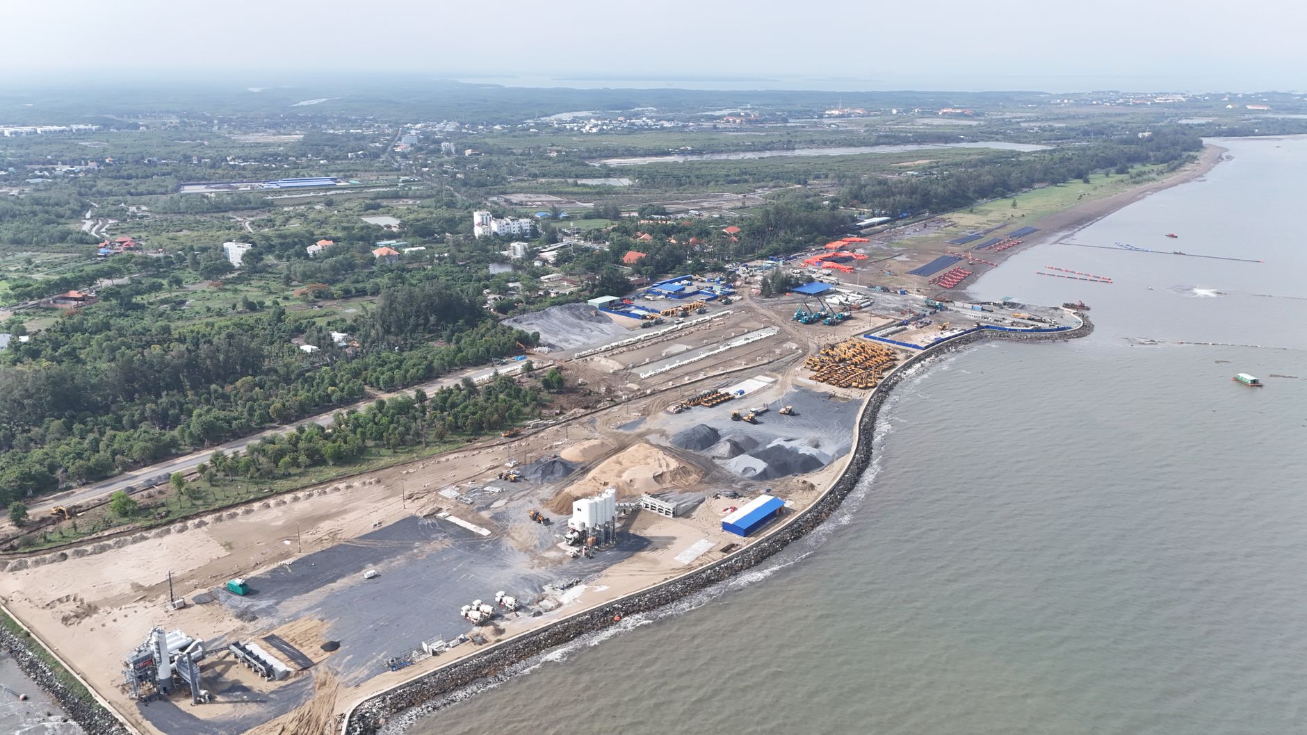 Aerial shot of a coastal industrial area in Vietnam, highlighting development and infrastructure.