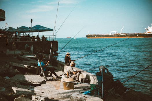 Fishermen enjoy a picturesque day by the Black Sea with a distant ship on the horizon.