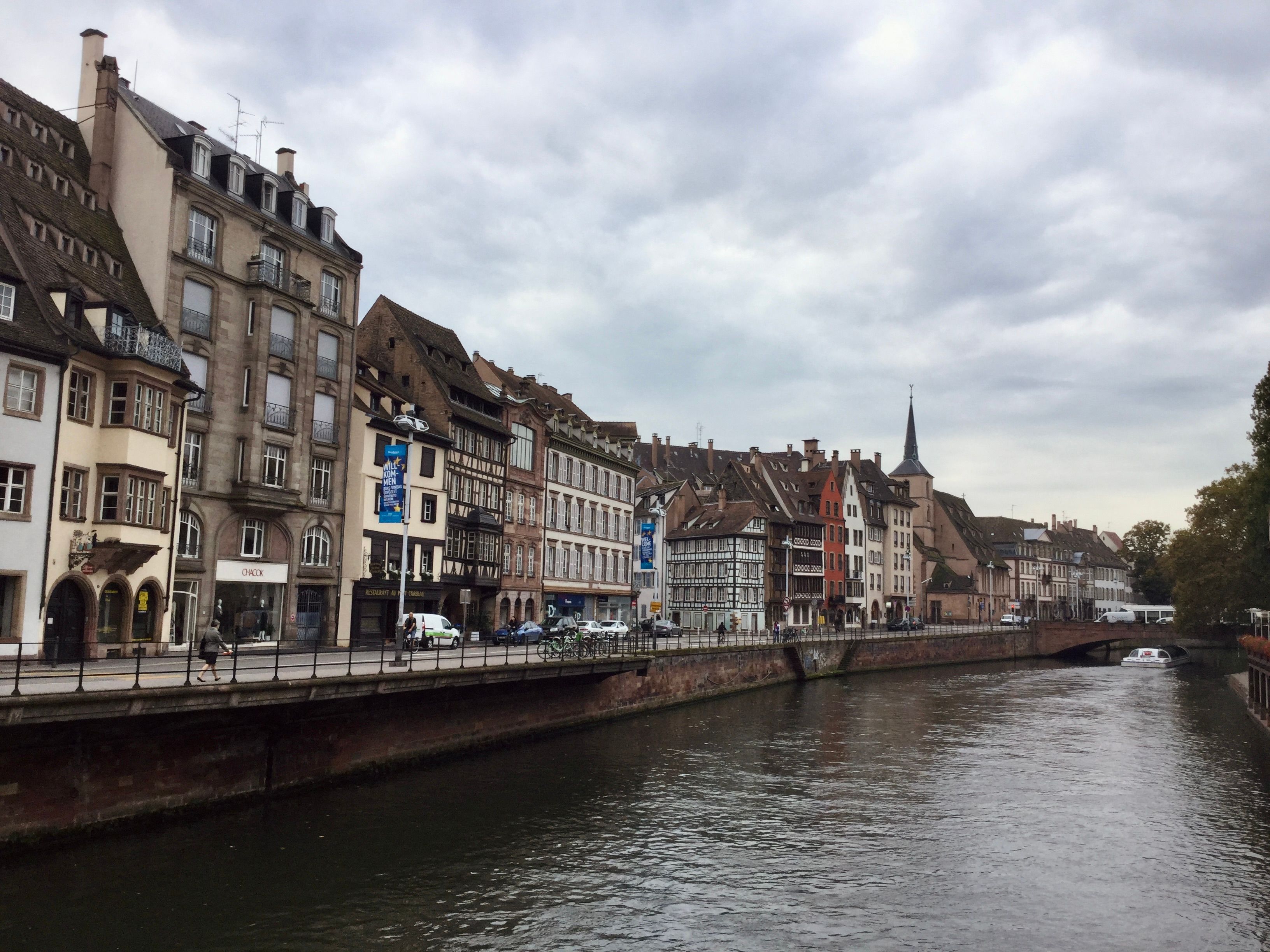 Discover the picturesque riverside of Strasbourg, France with its historic half-timbered houses.