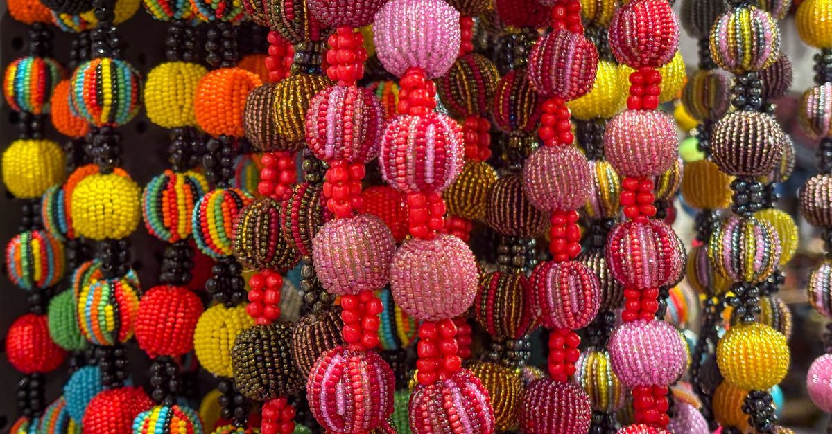 Colorful traditional beads on display at a market stall in Ho, Volta Region