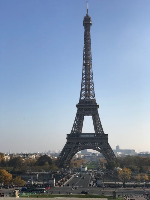 Free The Eiffel Tower stands tall on a clear day in Paris, France. Stock Photo