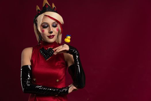 Artistic cosplay portrait featuring bold makeup and vivid colors in Mexico City setting.