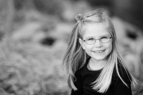 Free Grayscale Photography of Girl Smiling Stock Photo