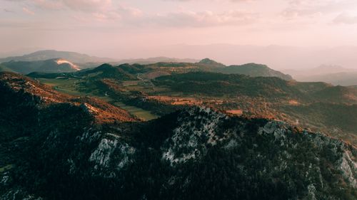 Free Breathtaking aerial view of Isparta's mountains at sunset with lush greenery and rolling landscapes. Stock Photo