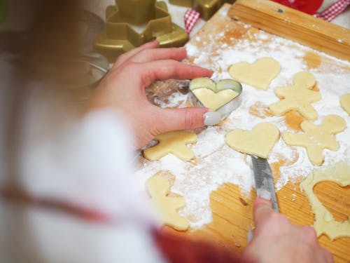 Close-Up Shot of a Person Molding Cookies